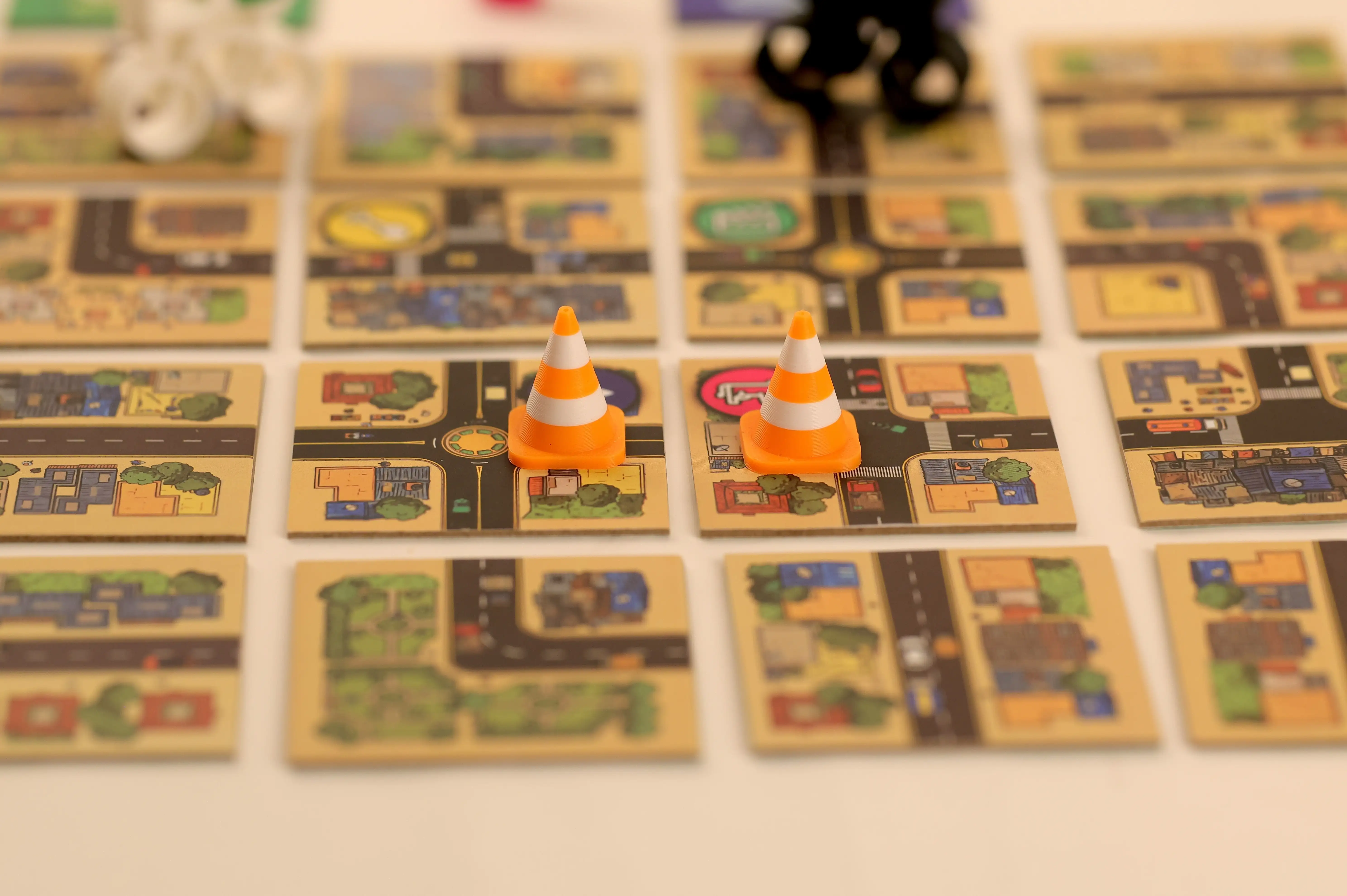 show a close up of traffic cones and event cards